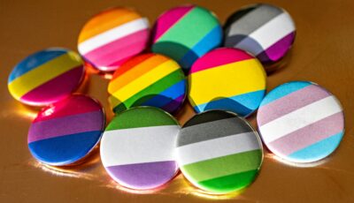 Assortment of LGBTQI+ Pride pins.