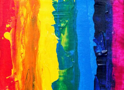 Rainbow flag made of paint strokes.